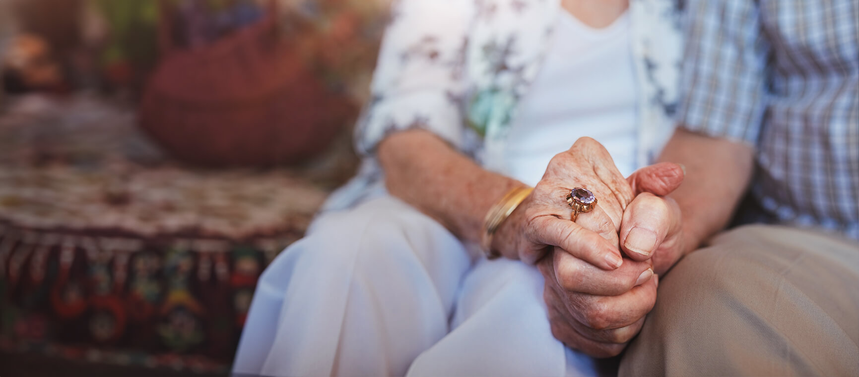 senior man holding his wifes hand